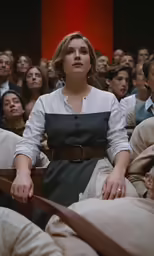 a group of people in a crowd sitting down
