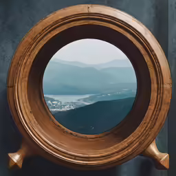 there is a wooden circle around some mountains