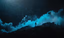 man on hill looking down at the sky,a person standing on top of a hill covered in fog