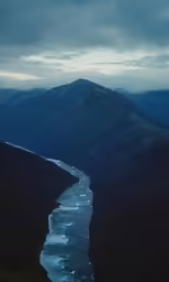 a mountain with a river flowing through it