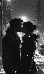 two people standing in the snow kissing