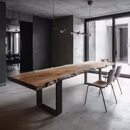 a long table that has some chairs on it