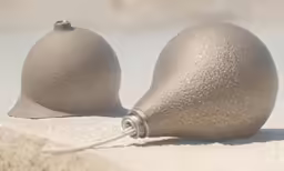 two grey ball shaped object placed next to each other
