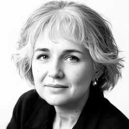 the woman is looking up in a black and white photo