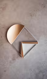 a gold and white sculpture that looks like an octagon