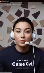 a woman wearing a black shirt and headphones is posing