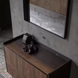 a camera sits on top of an entertainment cabinet
