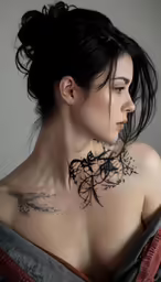 a woman has a floral tattoo on her back