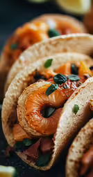 three pieces of bread that have some food in it