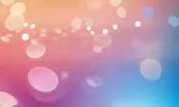 a blurry photograph of many circles with one pink and blue color