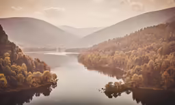 a picture of mountains with a body of water