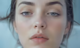 a young woman with very short eyelashes and eyeliners