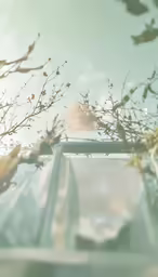 the blurry photo of a car in front of a flowering tree
