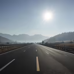 the sun is shining over an empty street