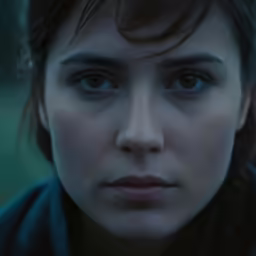a close - up photo of a girl with blue eyes