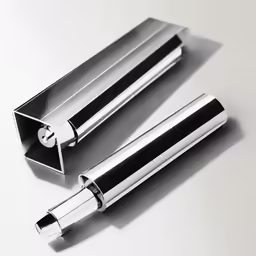 a pair of silver roller pen on a white table
