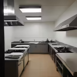 an industrial kitchen with many appliances and counters