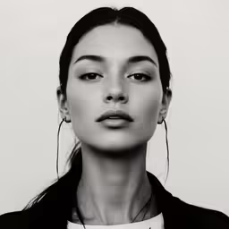 the woman is posing for a black and white photograph