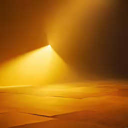 a very bright yellow light over some sand