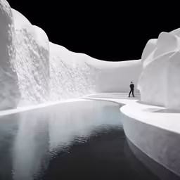 a man walking down a path next to a body of water