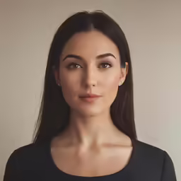 a woman with brown eyes and a black top