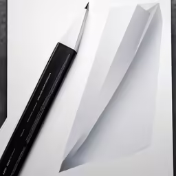 an artistic knife with a paper folding like a bird