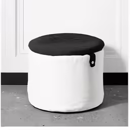 the small foot stool is black and white