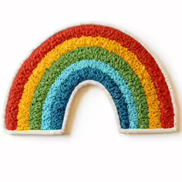 a rainbow shaped rug with various colors