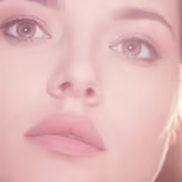 a woman looking directly into the camera with big eyes