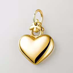 a gold heart with a bow on it,a heart locke with a black strip