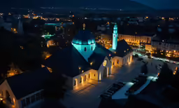 a view of a small church with glowing lights at night