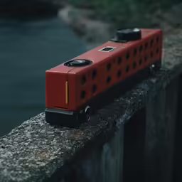 an orange train engine is on the rail
