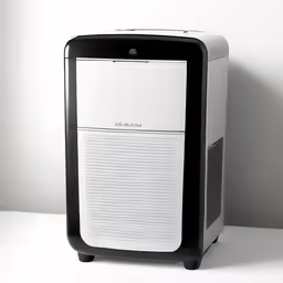 a white and black computer sitting on top of a table
