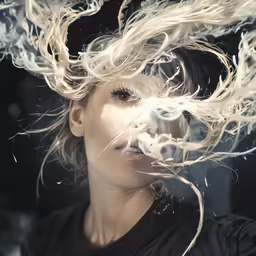 a woman with white hair and blowing blow on her head