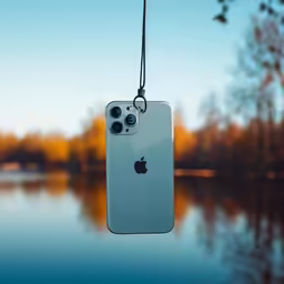 an iphone case hanging from the top of a hook