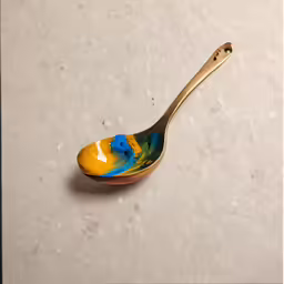 a close up of a spoon on a table