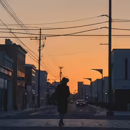 a person walking across a street with an old car in the distance