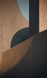 a building with lots of concrete walls and light on it