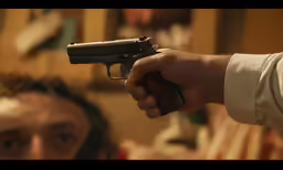 a person holding a gun in his hand