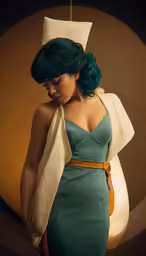 a woman in blue dress wearing a white towel and head scarf