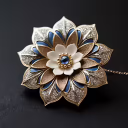 a blue and white broochy sitting on top of a black table