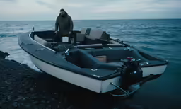a man that is standing next to a boat