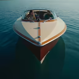 two people in an old boat on water