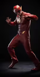 the flash costumed in a red outfit poses in a studio photo