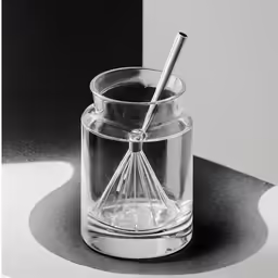 a metal object sitting on top of a black table