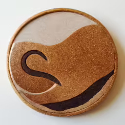 a brown, wooden button with a black swirl in the center