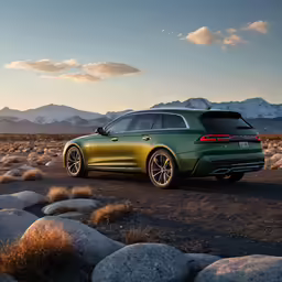 a green sports utility vehicle driving in the desert