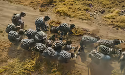 a group of motorcyclists are racing in the desert