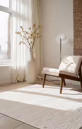 an empty white rug with flowers in vases by window