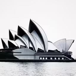 the sydney opera is seen from the water